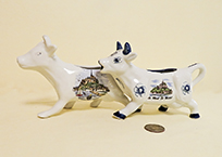 two souvenir cow creamers from Mt St Michel