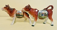 Two La Panne souvenir cow creamers