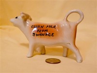 Swanage advertising cow creamer, left