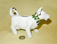 White cow creamer with wreath