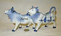 Two Delft cow creamers from similar molds, left