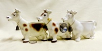 Three Goebel cow caricature creamers