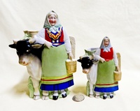 2 S&V pitchers of Swedish lady standing by her black faced cow