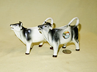 2 Black and white realistic Goebel cow creamers