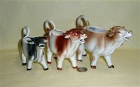 Three realistic Goebel cow creamers