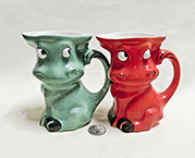 Orange and Green Goebel caricature cow pitchers