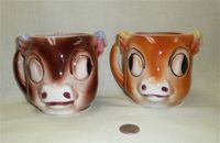 2 Japanese cow caricature head pitchers