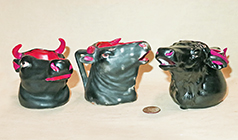 3 black and red Royal Bayreuth cow head creamers