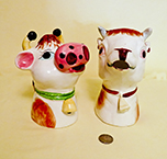 2 'Moo-ing' cow head and neck creamers