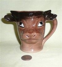 Emglish cow head pitcher with verse, front