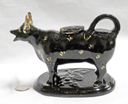 Classic Jackfield cow creamer with speckles