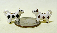 2 black and white V&R cow creamers