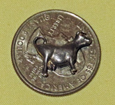 silver colored metal cow
