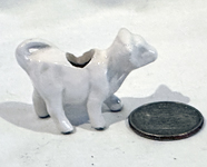 large white doll house ' cow