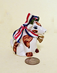 Sitting up cow creamer with ribbon