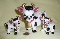 Black and white 'cute' cow creamer w/S&P