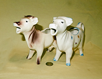 Two similar cow creamers from Western Germany