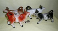 Four German small cow creamers with mnold mark 3872