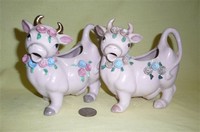 Two Japaene purple cow creamers with flowers