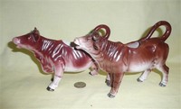 Two reddish brown German realistic porcelain cow creamers