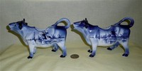 German cow creamers with Delft patterns, side