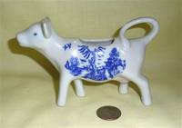 White cow creamer with blue transfer print