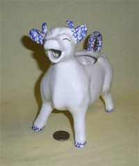 Large white with blue cow creamer with Elsie-like face