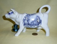 white cow creamer with poorly applied transfer print
