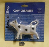 Small RPI white with black spots cow creamer in plastic wrap