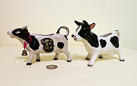 Two black and white cow creamers from UK