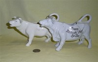 Two German porcelain white cow creamers with Scottish sayings
