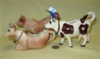 Three hone painted and embellished cow creamers