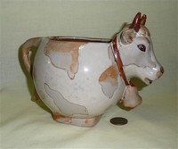 Mottled grey and brown spherical legless cow creamer