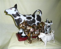 3 Maitland-Smith cow creamers and a Goebel one for size comparison
