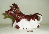 lying down older brown and whute cow creamer from UK