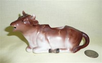 Hard porcelain brown shaded kneeling cow creamer