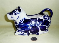 Kneeling blue and white cow creamer