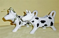Two Pier 1 white & black cow crteamers