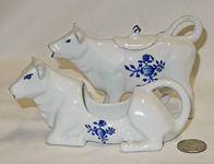 Two German white with blue cow creamers