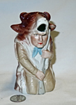 Hunter in cow suit creamer, front