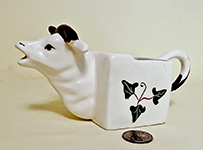 square bodies cow creamer wityh ivy decorations