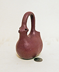 Small clay cow pitcher or creamer with handle