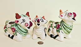 Threeo nose-licking cow caricatrure creamers from Occupied Japan