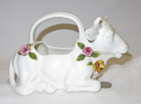 white cow creamers with raised ceramic flowers