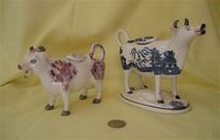 two traditional cow creamers