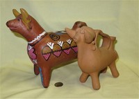2 clay bull pitchers or jugs
