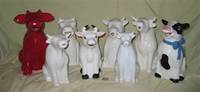 8 large sitting cow pitchers