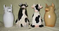 4 more large sitting cow pitchers