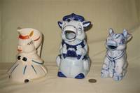 3 odd looking cow pitchers