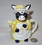 Black cow with white nose lady pitcher